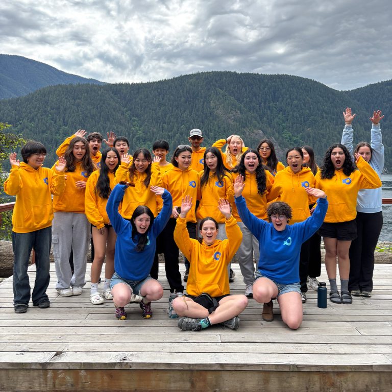 A cohort of youth participants in yellow Ocean Wise sweaters